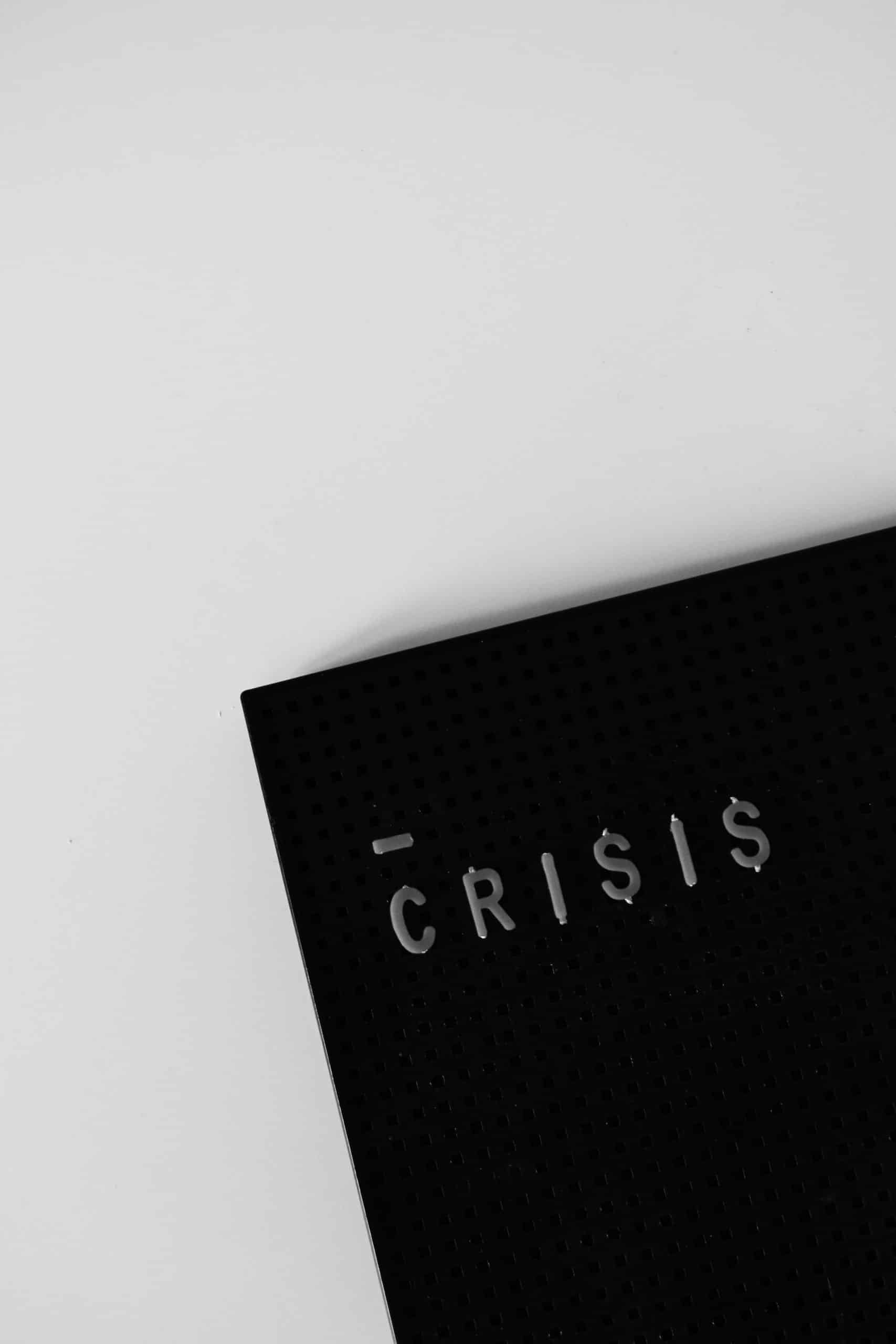 board with crisis written on