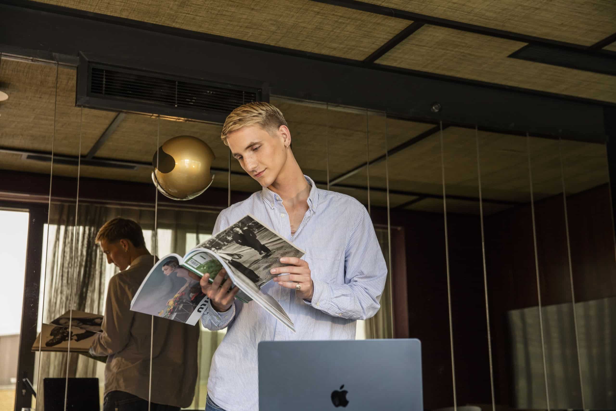 man reading magazine